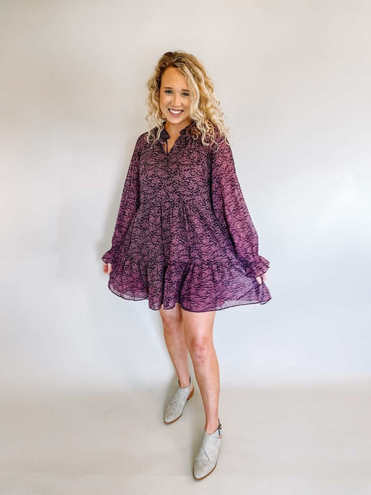  swing mini dress  with three tiers in egg plant color with mauve floral print ruffled collar, tie detail on neck  long flounce sleeves fully Lined